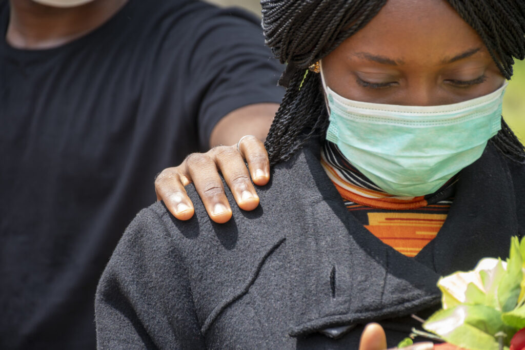 CLOSEUP SHOT OF AN AFRICAN FEMALE AT A FUNERAL WIT 2023 11 27 04 50 03 UTC 2048X1365 1